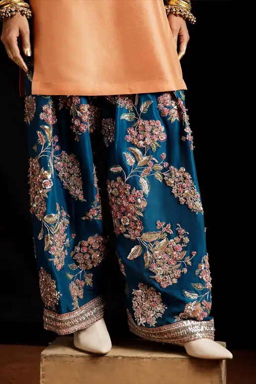 Vaskas - HR pakistani fashion outfit in peach, blue, teal tones.